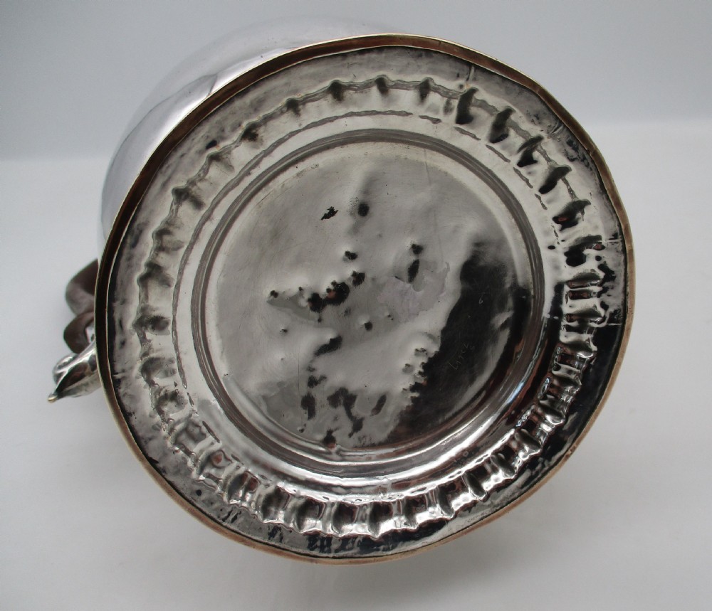An 18th-century baluster-shaped Sheffield plate coffee pot featuring a wooden carved handle, decorative spout, and gadrooned base. View IX