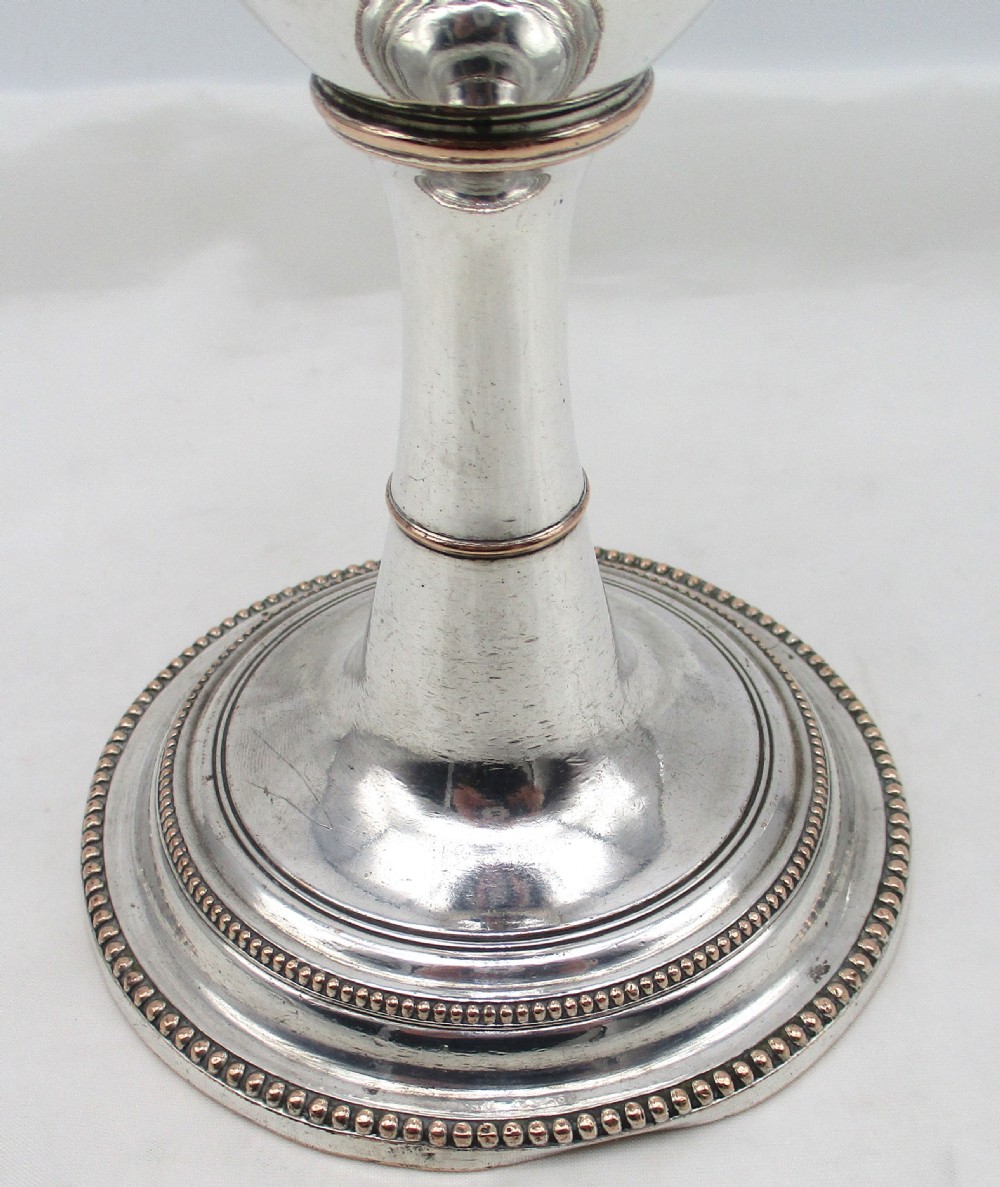An 18th-century Sheffield plated silver chalice featuring a tapered bowl, a turned stem, a beaded foot rim, and a gilded interior. View II