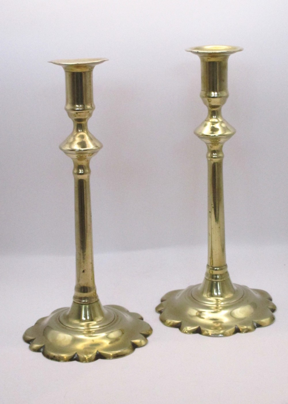 A Pair of Tall Georgian Brass Candlesticks View II