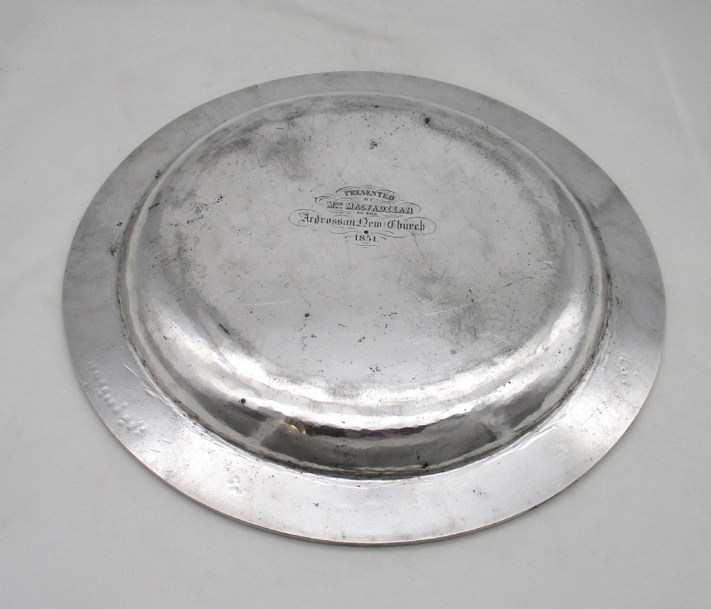 A pair of circular 14-inch silver-plated charger plates with polished central wells and simple reeded rims. View III