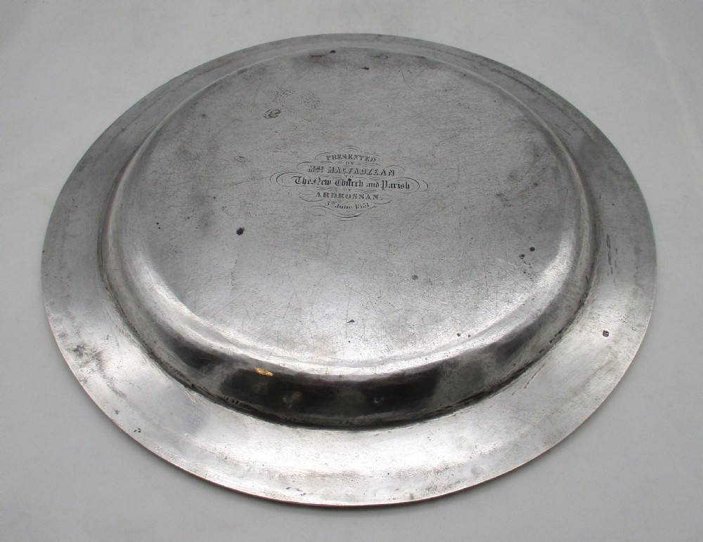 A pair of circular 14-inch silver-plated charger plates with polished central wells and simple reeded rims. View VII