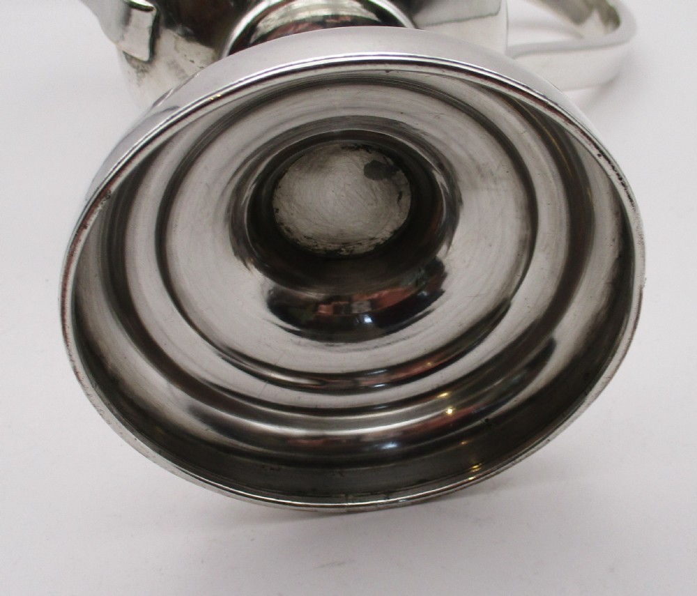 A 19th-century silver-plated two-handled loving cup with a gilt interior and central monogram engraving on a stepped circular pedestal base. View VII