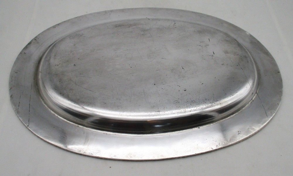 A pair of oval mid-nineteenth-century silver-plated meat platters featuring gadrooned rims and engraved crests. View VI