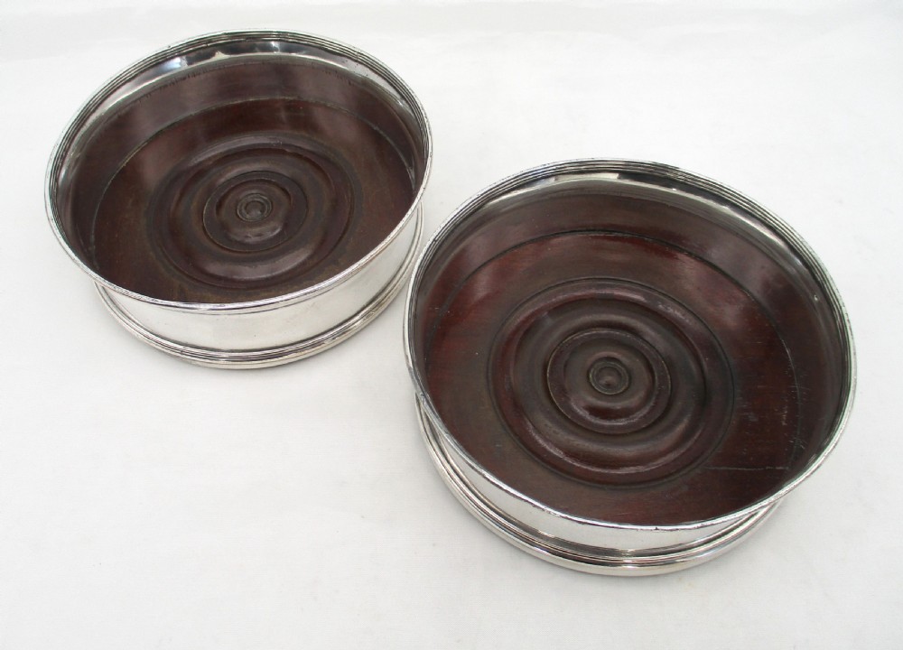 Fine Pair of Old Sheffield Plated Regency Coasters with Turned Mahogany Bases View II