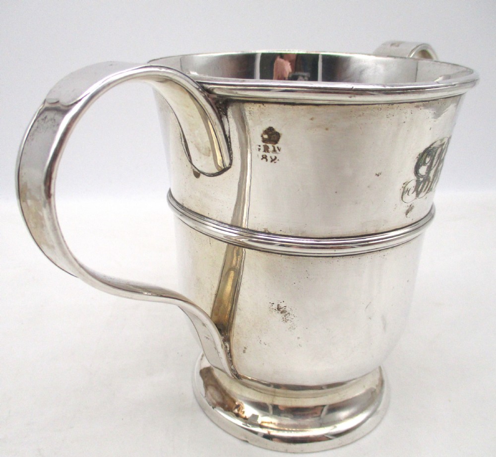 An antique silver-plated two-handled loving cup featuring a central girdle band, moulded foot, and an engraved monogram. View V