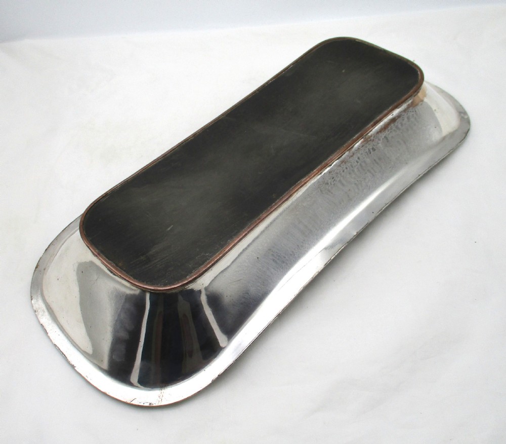 An elongated 19th-century Old Sheffield silver-plated tray featuring a rectangular form with rounded ends and a beaded outer rim. View VIII