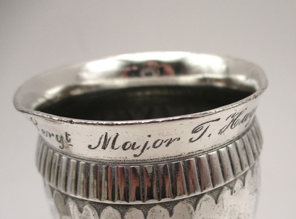 A set of four silver-plated goblets with engraved military ranks, hammered bodies, and reeded base rims. View III