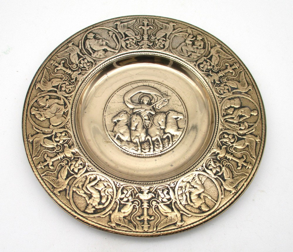 A circular 19th-century bronze platter featuring a central relief of a classical chariot and an ornate outer rim detailed with mythological figures and grotesques. View II