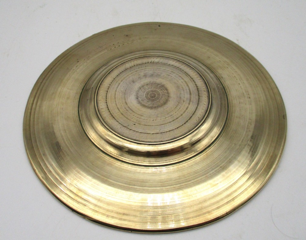 A circular 19th-century silver-plated bronze platter featuring a central relief profile of Emperor Ferdinand III on horseback surrounded by detailed equestrian vignettes and ornate scrolling foliage. View VI