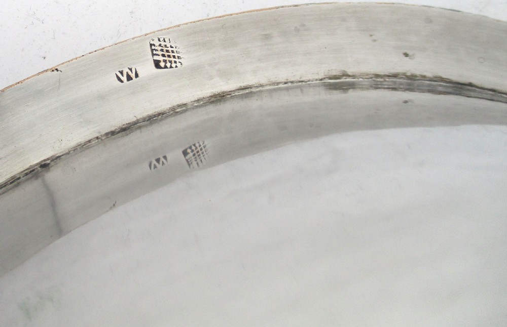 An oblong silver-plated knife tray featuring a gadrooned rim and a smooth polished interior well. View X