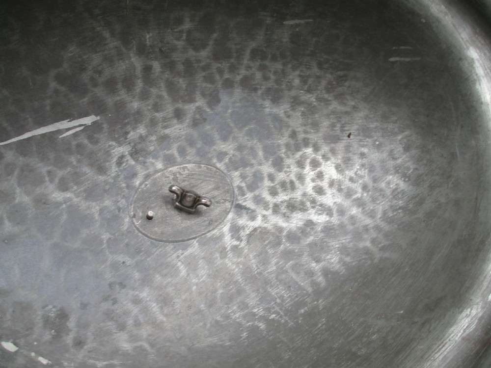 An oval Old Sheffield Plated meat dome featuring a moulded rim, an engraved crest, and a cast scrolling handle. View VIII