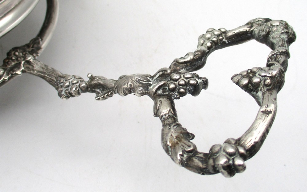 A pair of 19th-century silver-plated decanter coasters mounted on a wheeled carriage trolley with turned wooden bases and a decorative handle. View VIII