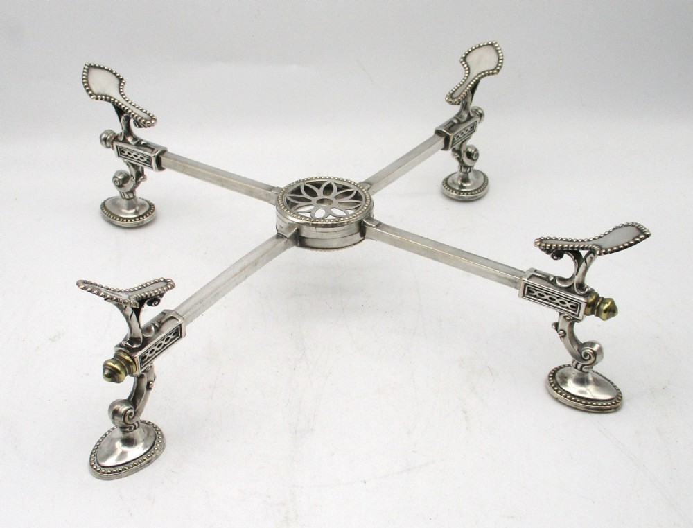 An antique Georgian Sheffield plated silver dish cross featuring four adjustable sliding arms with beaded support pads and feet. View III