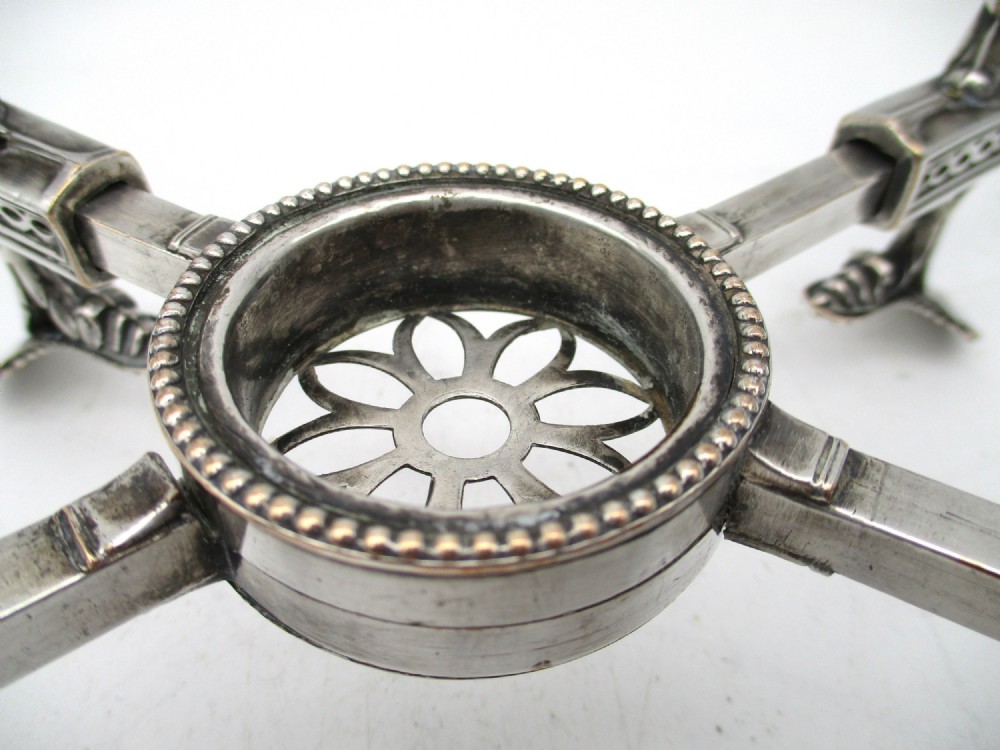 An antique Georgian Sheffield plated silver dish cross featuring four adjustable sliding arms with beaded support pads and feet. View XI