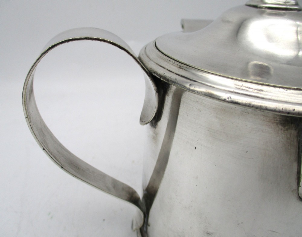 A cylindrical mid 19th-century silver-plated argyll gravy warmer with a rounded lid, ball finial, double spout, handle, and engraved cursive monogram. View IV