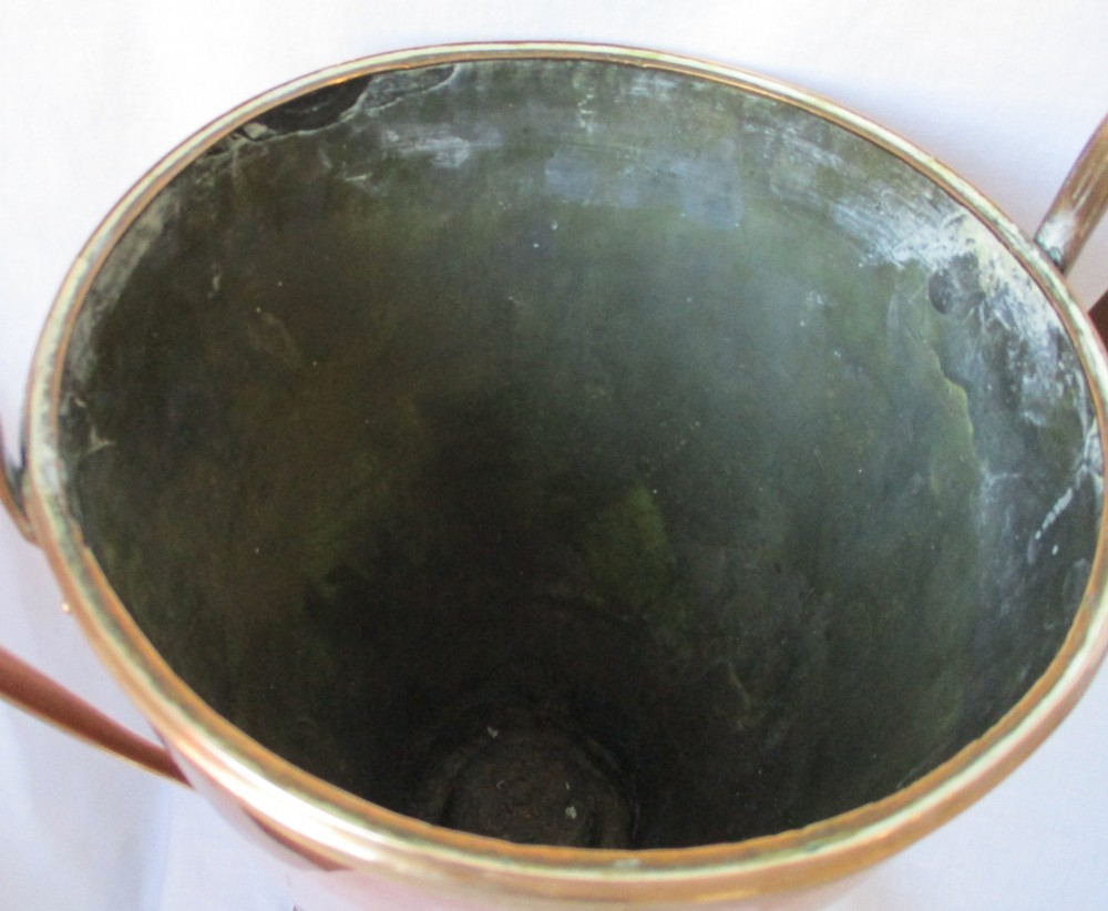 An early nineteenth-century copper tea urn featuring loop handles, a brass spigot, a decorative finial, and a square stepped pedestal base. View V