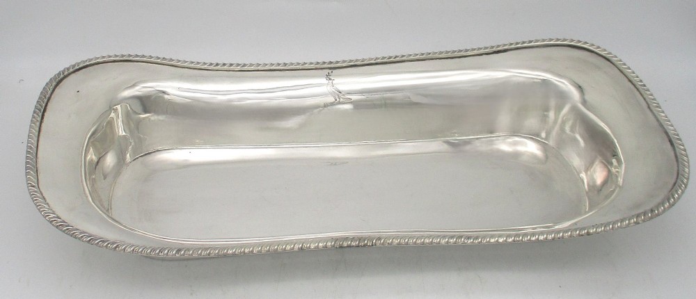 An elongated 19th-century silver-plated knife tray with a gadrooned rope-twist border rim and an engraved motif on the inner wall. View III