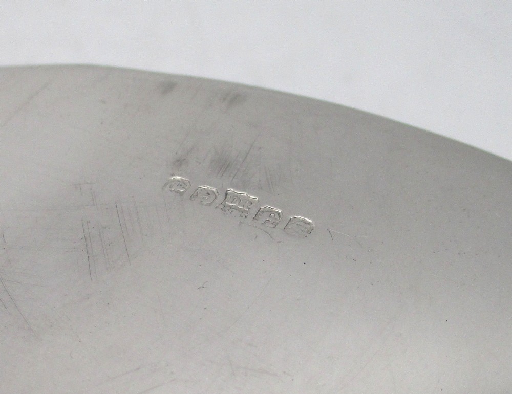 An elongated 19th-century silver-plated knife tray with a gadrooned rope-twist border rim and an engraved motif on the inner wall. View X