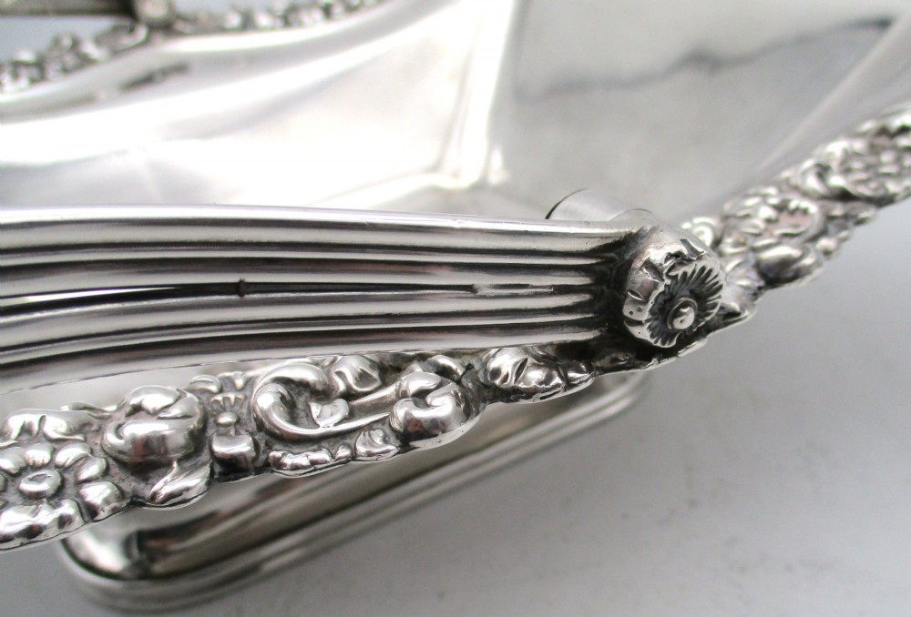 A Regency silver-plated fruit basket featuring a lobed rim with embossed floral motifs and a hinged overhead handle. View IX