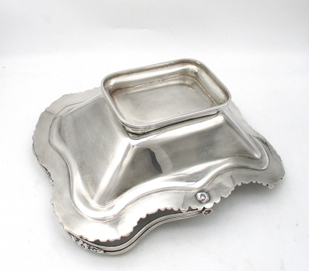 A Regency silver-plated fruit basket featuring a lobed rim with embossed floral motifs and a hinged overhead handle. View XI