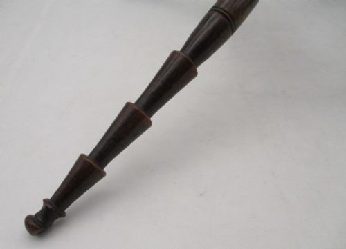 A Georgian turned dark mahogany fire cat featuring six radiating spoked arms attached to a central turned baluster hub. View XI