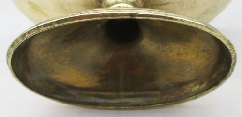 A pair of oval brass pedestal bowls with stamped geometric rim borders and turned flared bases. View VI
