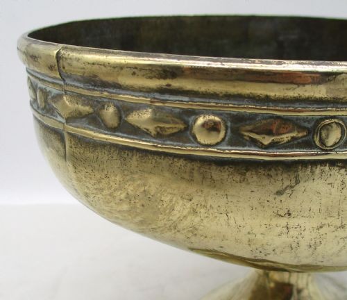 A pair of oval brass pedestal bowls with stamped geometric rim borders and turned flared bases. View VII