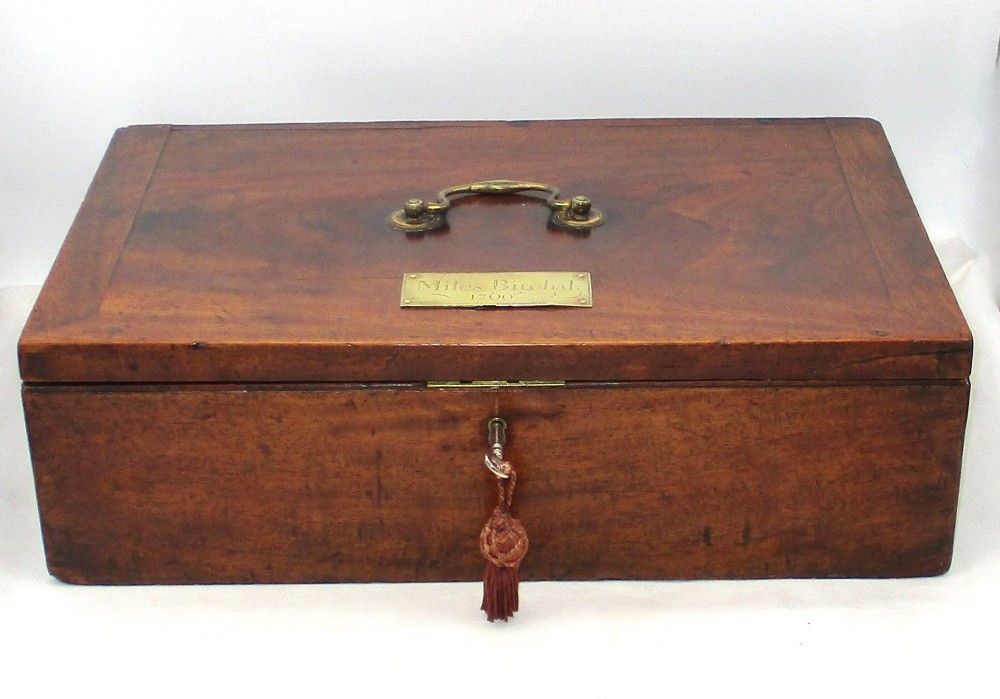 A rectangular mid-18th-century mahogany document box featuring a top brass swing handle, an engraved brass nameplate, and a brass keyhole escutcheon.