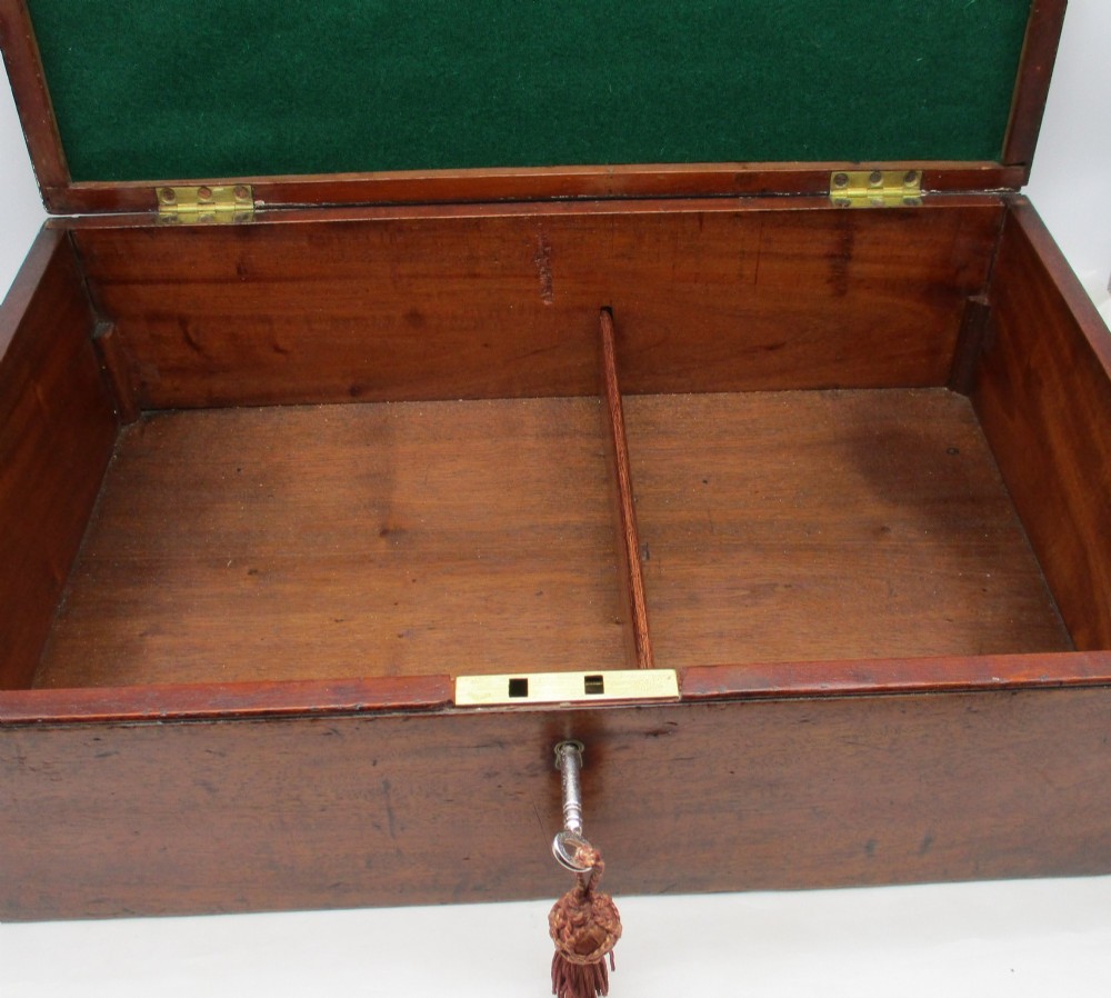 A rectangular mid-18th-century mahogany document box featuring a top brass swing handle, an engraved brass nameplate, and a brass keyhole escutcheon. View VIII