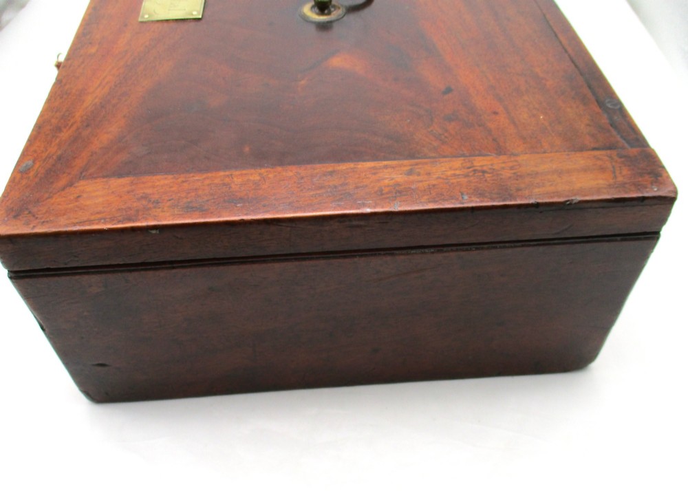 A rectangular mid-18th-century mahogany document box featuring a top brass swing handle, an engraved brass nameplate, and a brass keyhole escutcheon. View XIII