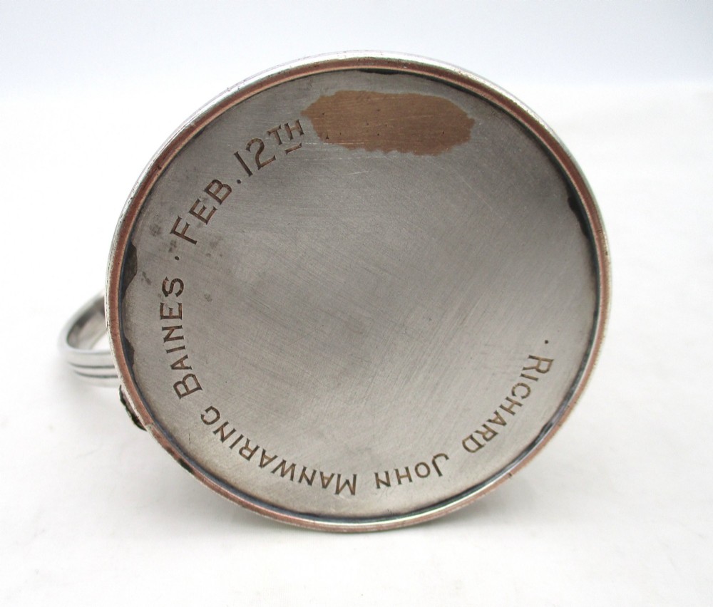 A Regency period Old Sheffield Plate childs tankard featuring horizontal reeded banding, a curved handle, and a gilt-lined interior. View VI