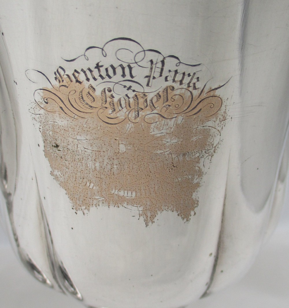 A pair of silver-plated Old Sheffield chalices featuring fluted lower bowls, raised lobed bases, and gilded interiors engraved with chapel inscriptions. View V