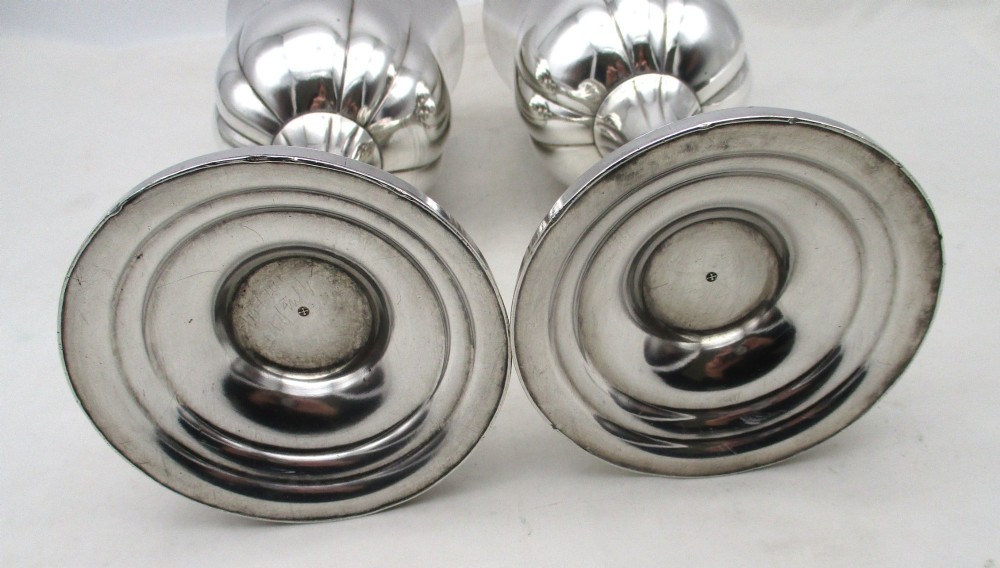 A pair of silver-plated Old Sheffield chalices featuring fluted lower bowls, raised lobed bases, and gilded interiors engraved with chapel inscriptions. View IX