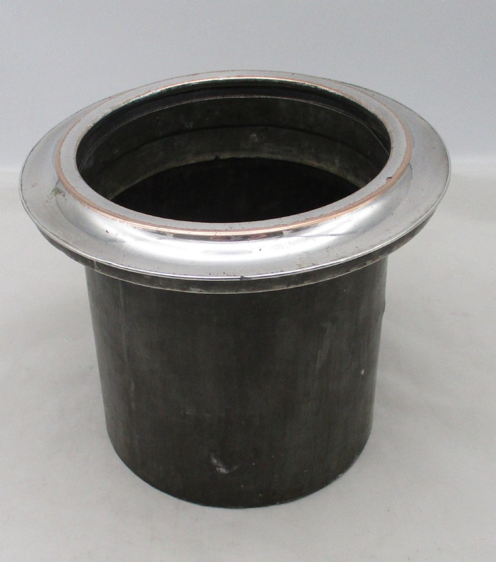 A Georgian silver-plated double-handled wine cooler featuring an engraved family crest, foliage borders, and a pedestal base. View XII