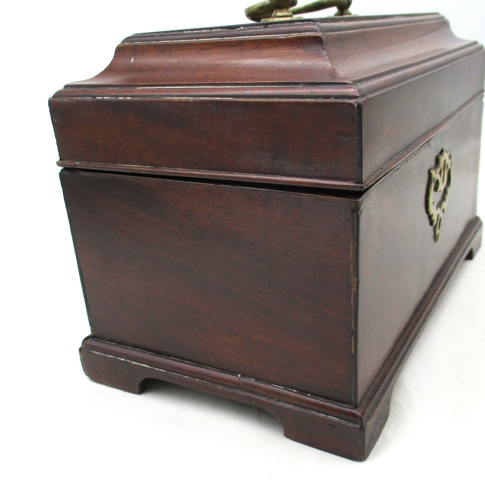 A rectangular George III mahogany tea caddy featuring a stepped hinged lid, a brass swan-neck handle, and a pierced brass keyhole escutcheon. View XI