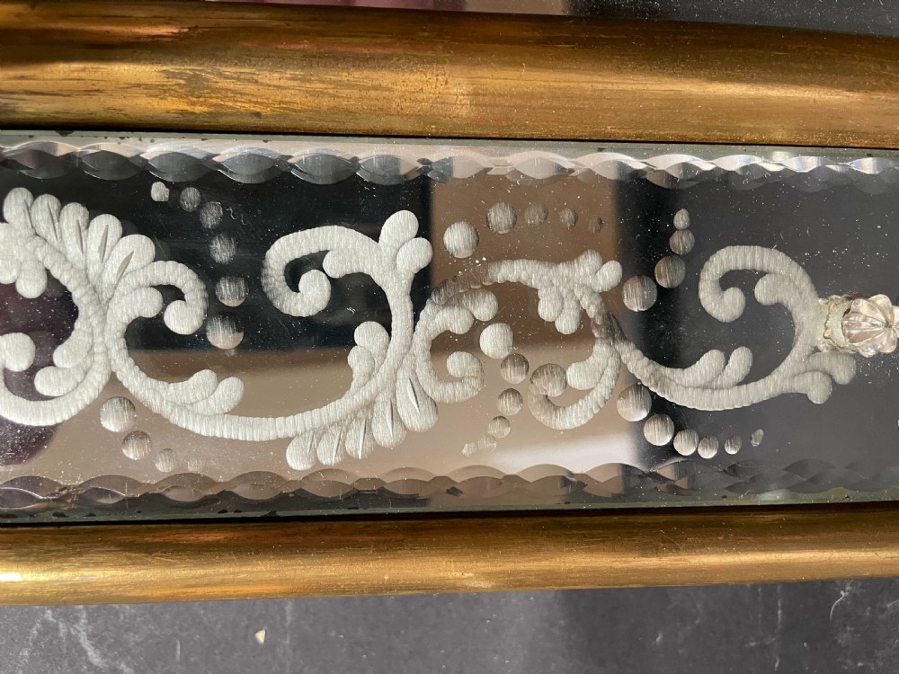 A rectangular Italian Venetian style wall mirror featuring etched glass floral borders, a gilt wood inner frame, and scalloped top and bottom mirrored extensions. View V