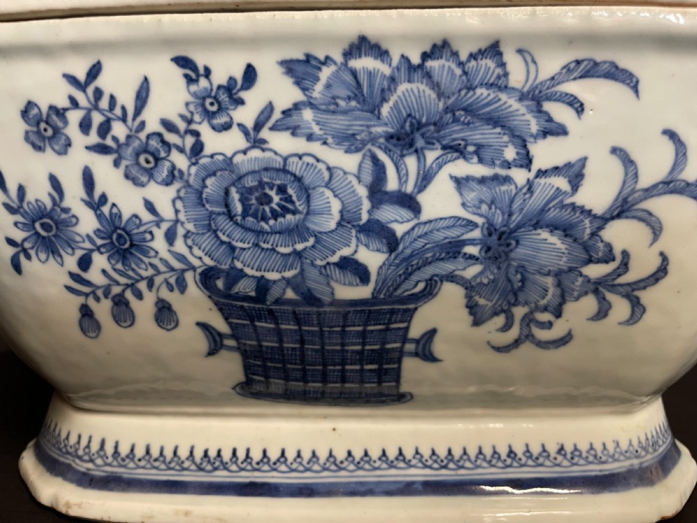 An antique blue and white Chinese export porcelain soup tureen and lid decorated with hand-painted floral motifs and geometric borders. View II