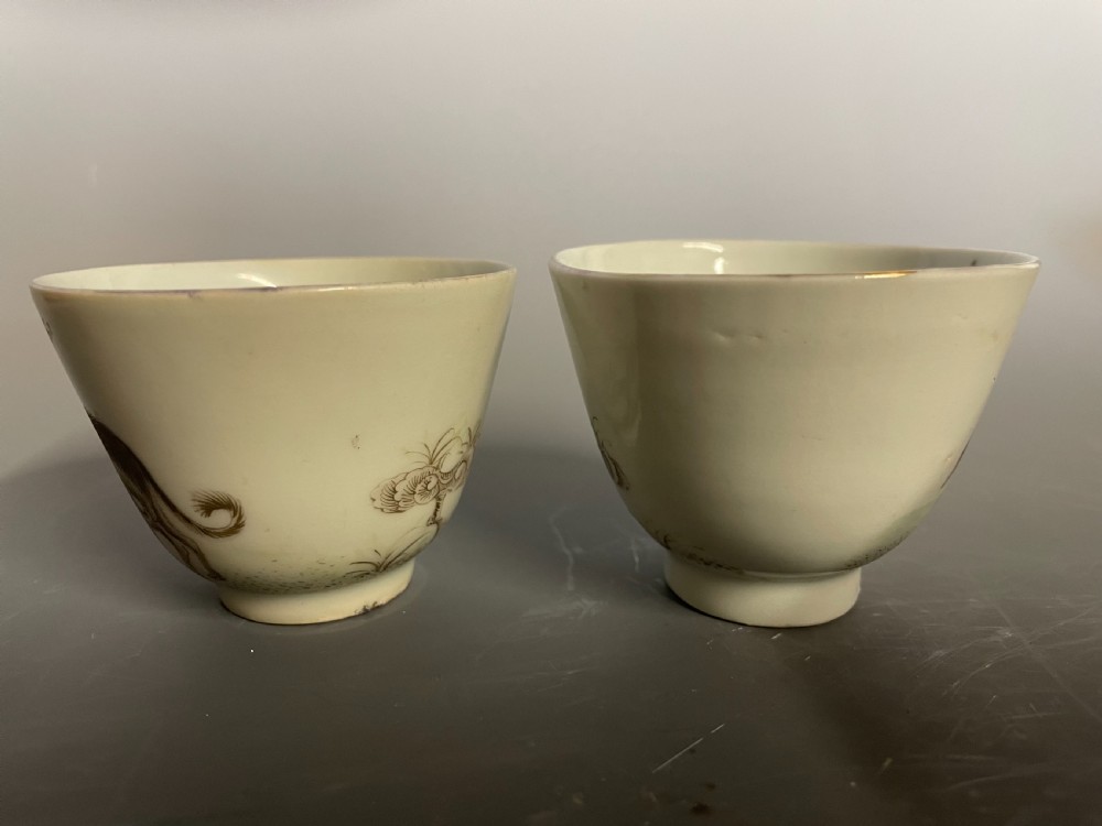 A pair of handleless Chinese export porcelain tea cups featuring hand-painted sepia greyhounds against an off-white ground. View VI