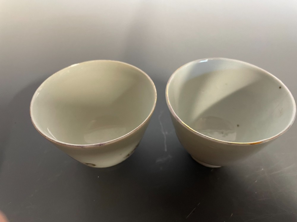A pair of handleless Chinese export porcelain tea cups featuring hand-painted sepia greyhounds against an off-white ground. View VII
