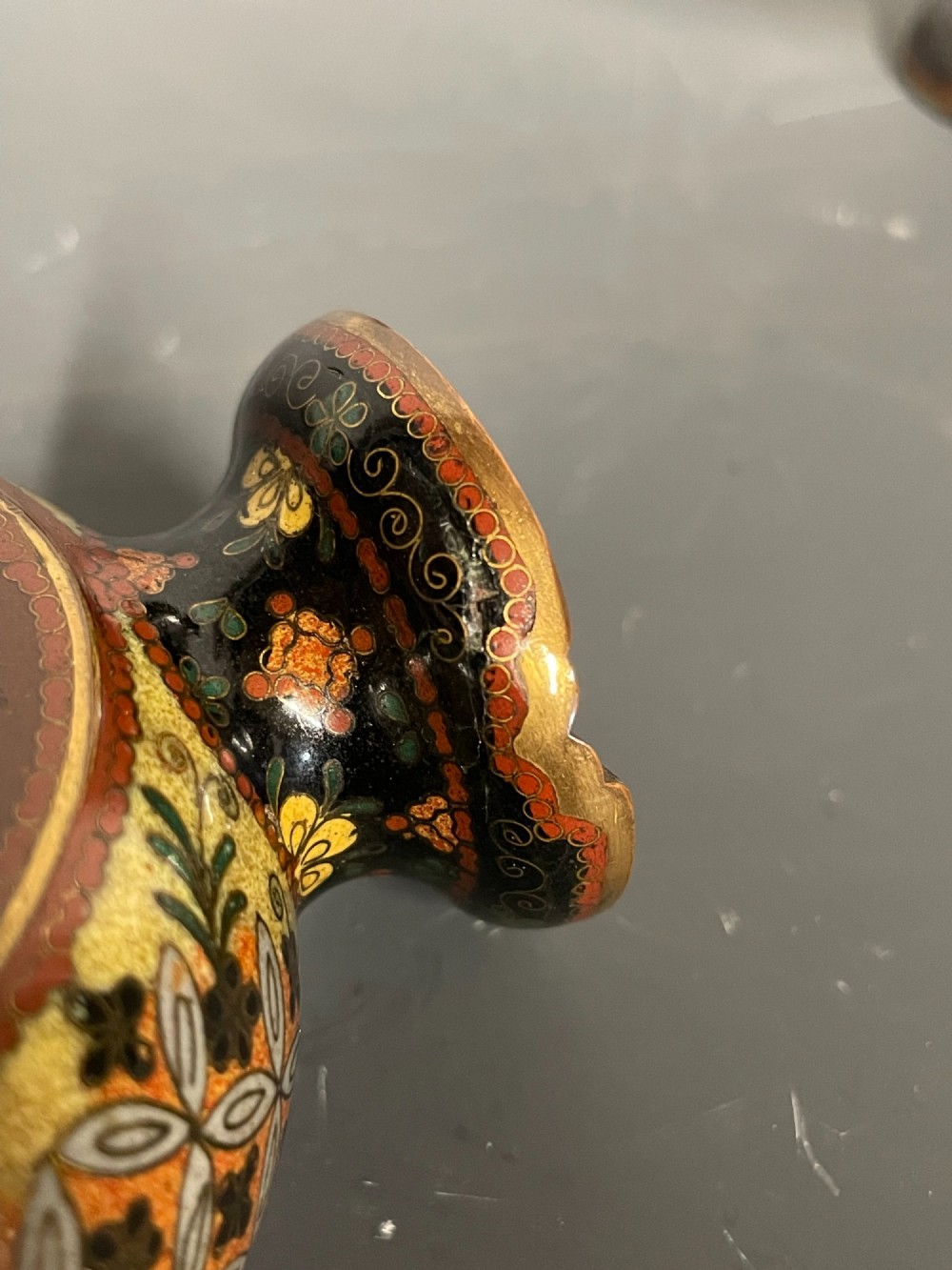 A pair of Japanese cloisonne enamel moon-flask vases featuring dragon medallions and floral scrollwork on flared bases. View VII