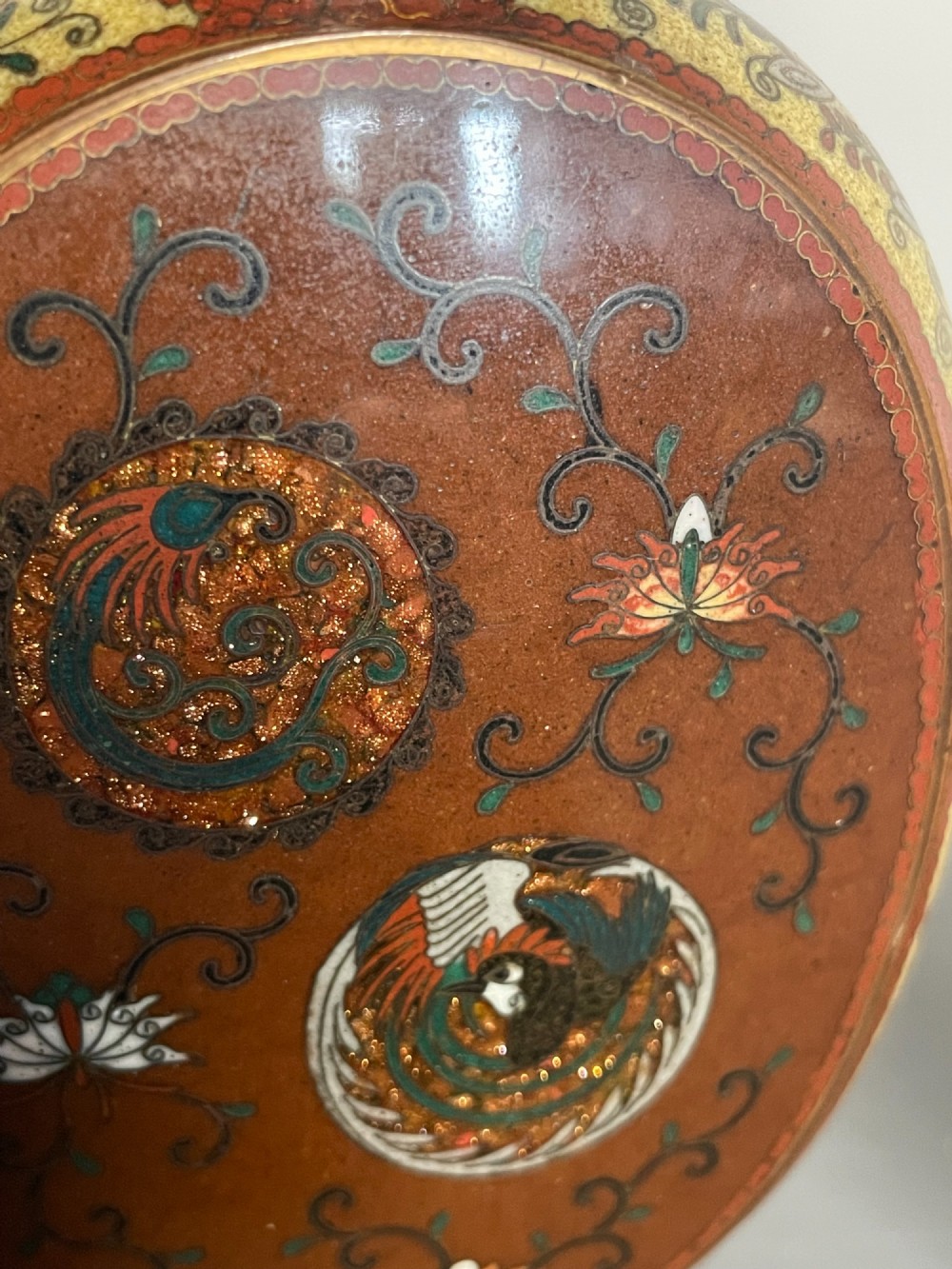 A pair of Japanese cloisonne enamel moon-flask vases featuring dragon medallions and floral scrollwork on flared bases. View IX