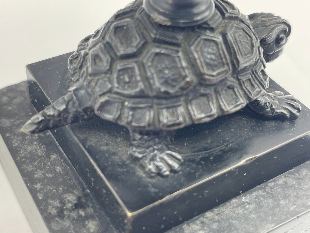 A carved coconut shell standing cup mounted on a bronze tortoise pedestal with a square stone base. View V