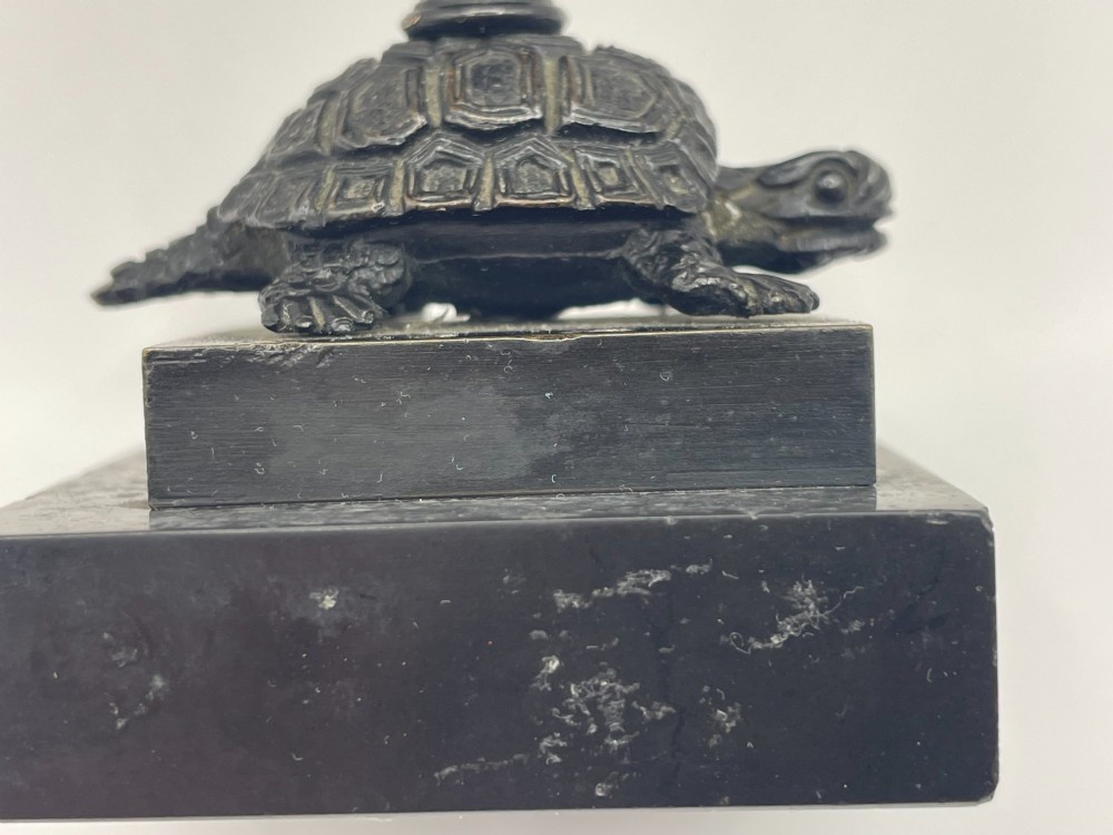 A carved coconut shell standing cup mounted on a bronze tortoise pedestal with a square stone base. View VII
