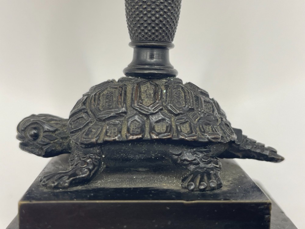 A carved coconut shell standing cup mounted on a bronze tortoise pedestal with a square stone base. View IX