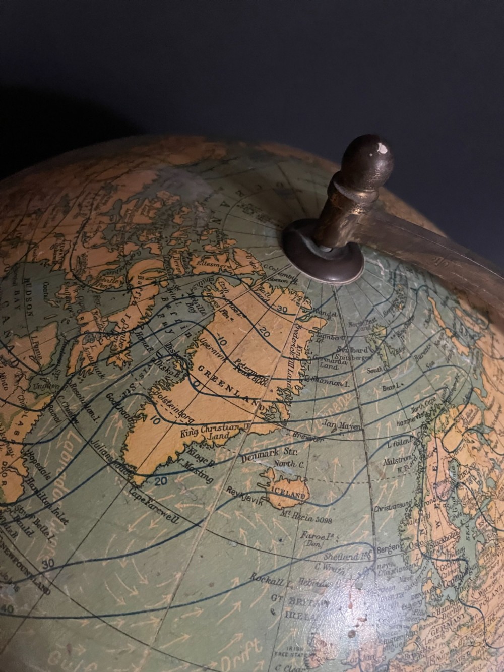 An antique terrestrial table globe mounted on a turned dark wood stand with a brass semi-meridian. View II