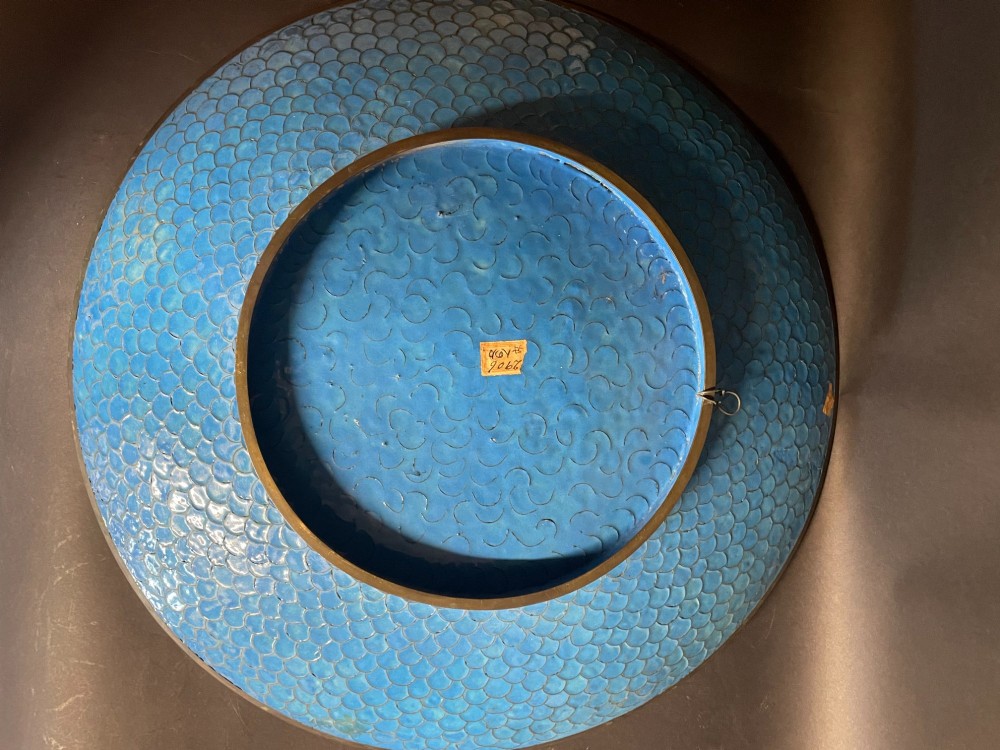 A circular Japanese cloisonne enamel charger depicting quails among chrysanthemums and lilies against a sky blue background with a patterned geometric border. View VIII