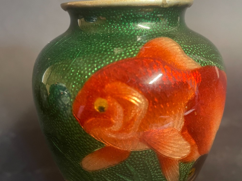 A baluster-shaped Japanese Gin-Bari cloisonne vase featuring swimming red and black goldfish against a translucent emerald green foil-backed enamel ground. View IX