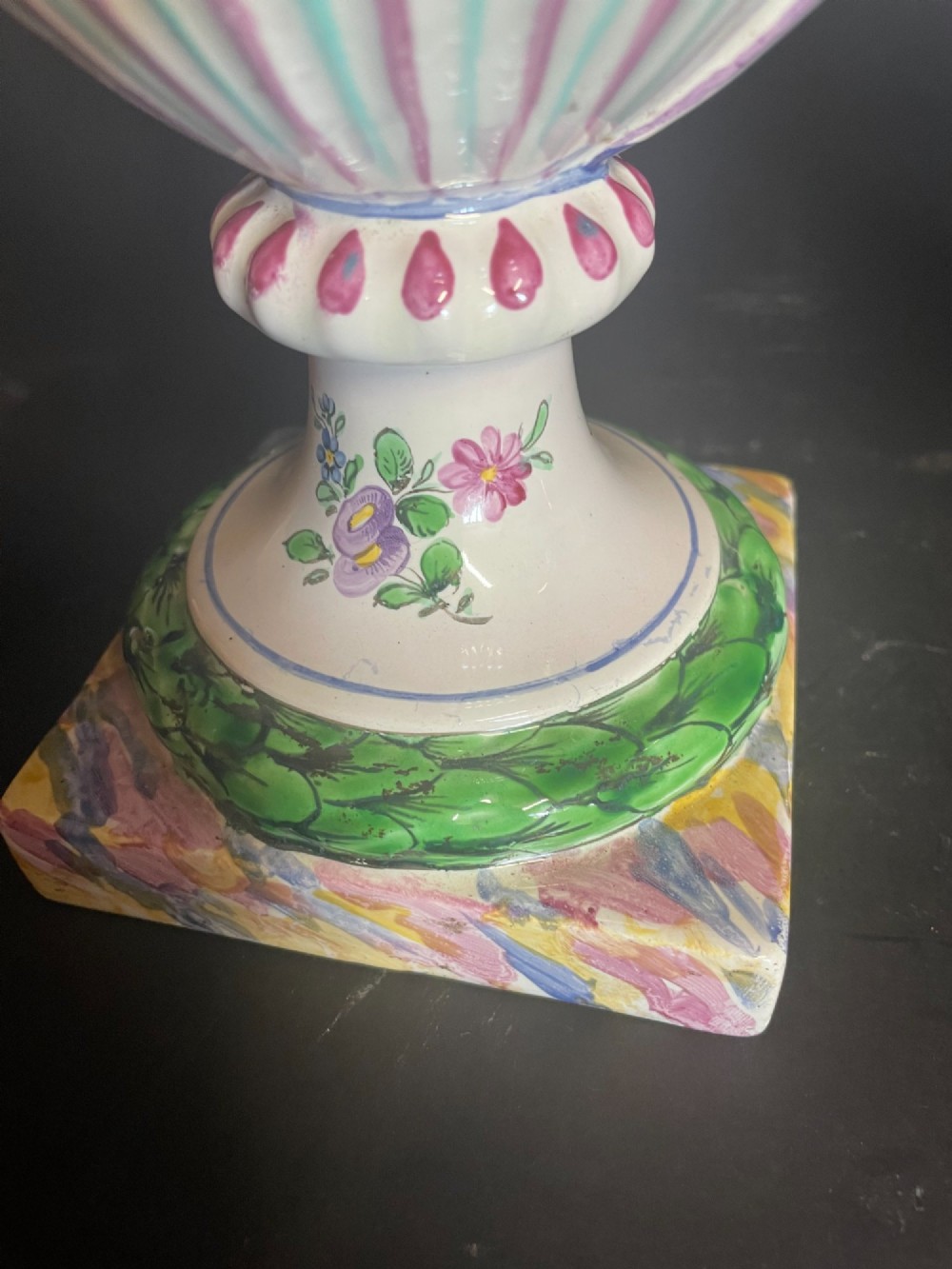 A pair of antique French Sceaux faience lidded urns decorated with hand-painted pastoral scenes, floral garlands, and moulding on square bases. View III