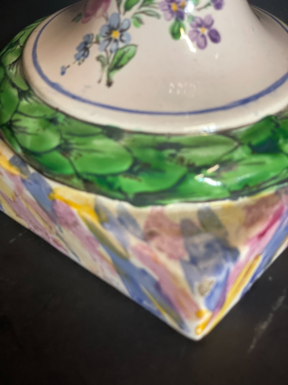 A pair of antique French Sceaux faience lidded urns decorated with hand-painted pastoral scenes, floral garlands, and moulding on square bases. View XIII