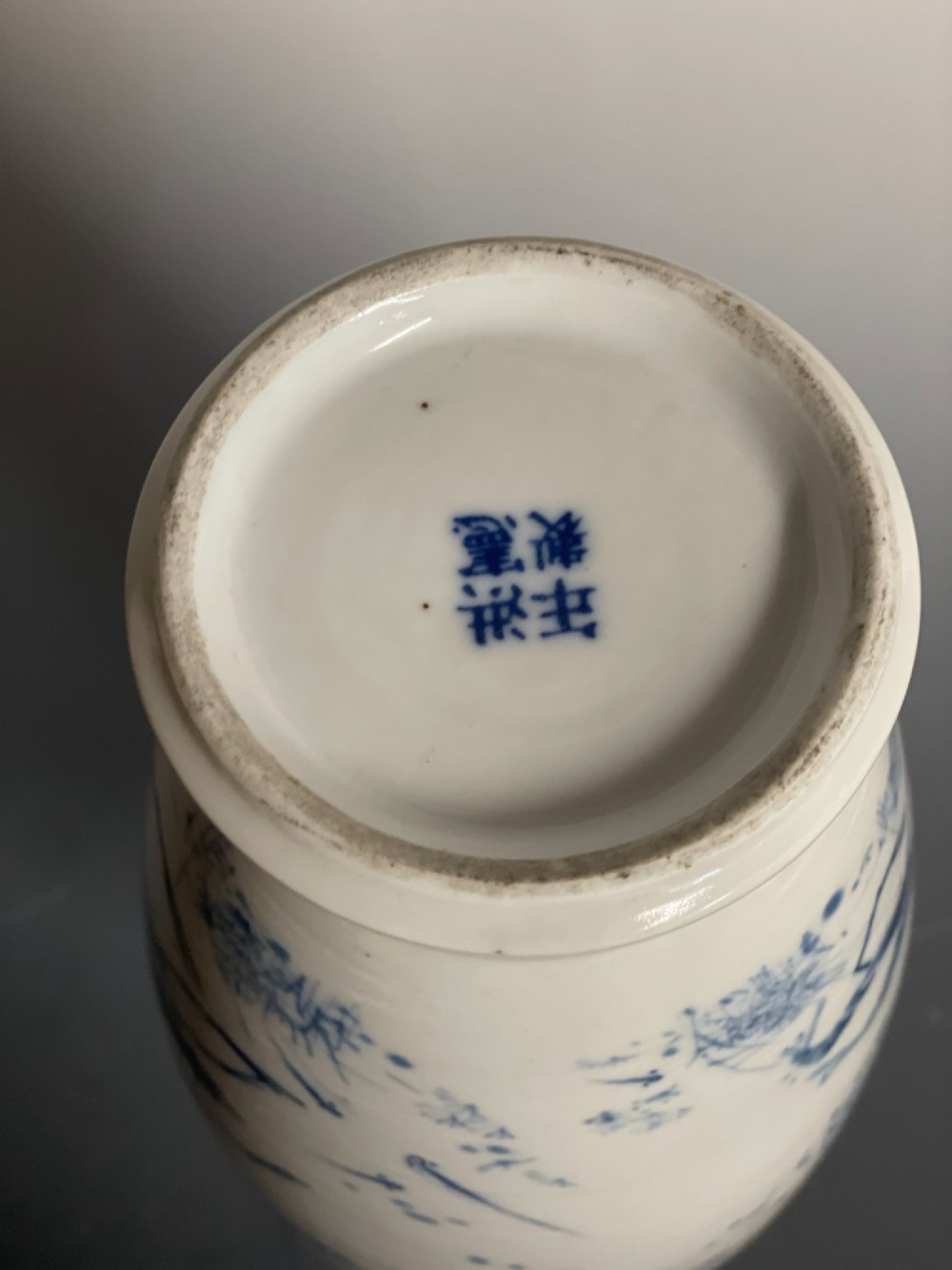 A tall white porcelain vase with a flared rim, featuring hand-painted cobalt blue shrimp motifs around the body. View VII
